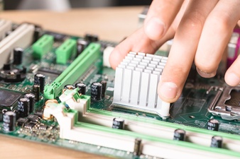 close up male technician hand s installing heatsink computer main board 23 2147883804 - Which Is A Better Brand: Huawei or Infinix?
